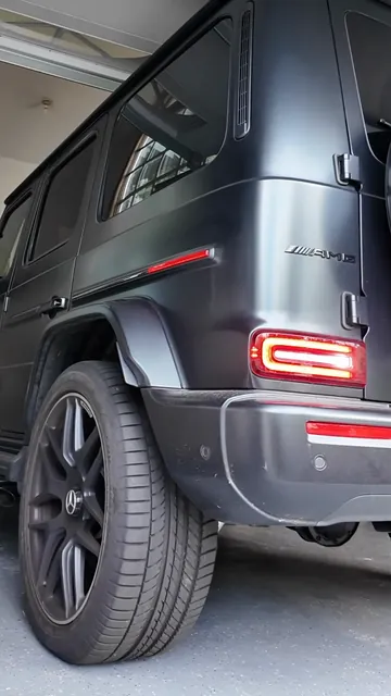 The dirty wheel and lower body of a G63 before any work