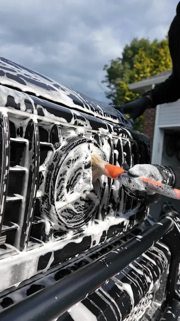A detailing brush worked through the front grille