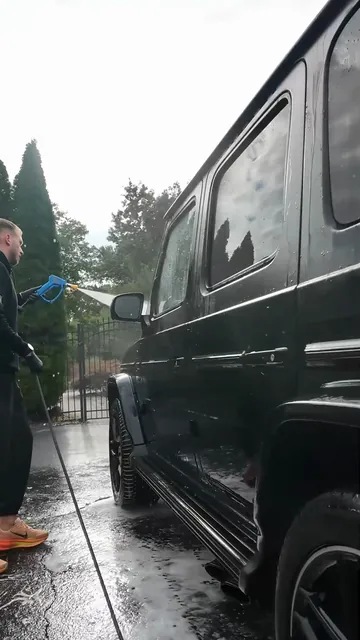 The foam rinsed off the side of the vehicle