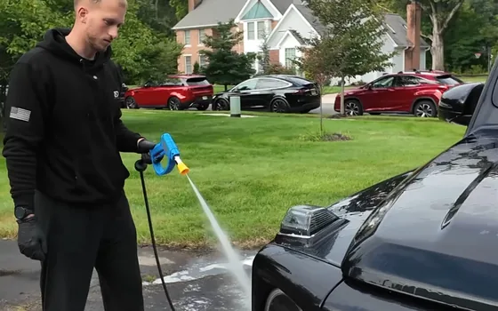 Andrew rinsing a G63 down before decontamination