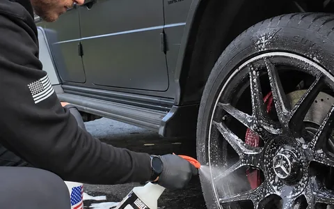 Wheel cleaner being sprayed onto a foamed G63 wheel