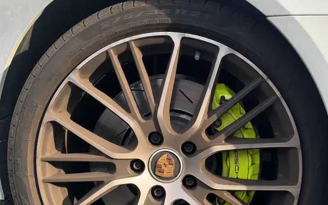 Porsche wheel before, buried under brake dust and embedded iron